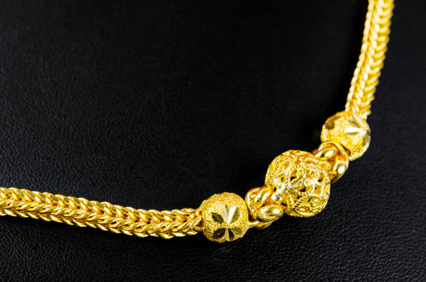 istock The Gold necklace on black leather. 1389688763
