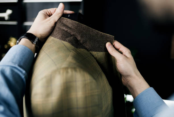 istock tailor makes an inspection of  suit 1389689010
