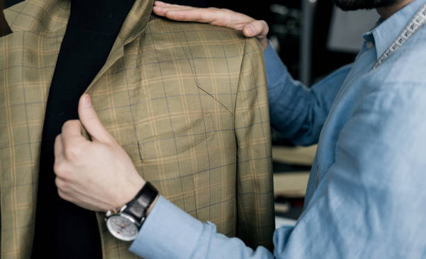 istock tailor prepares a suit for showing 1389689020