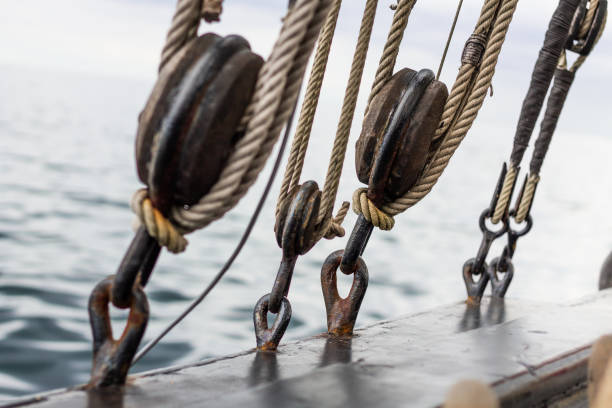istock Old boat pulleys and hoists. Marine and sailing background 1389689625