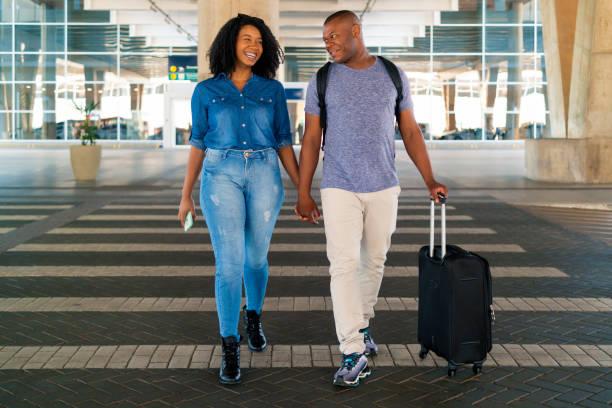 istock Couple at the airport. 1389690193
