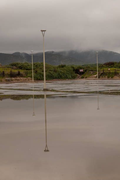 istock Flooded beach parking lot 1389690399