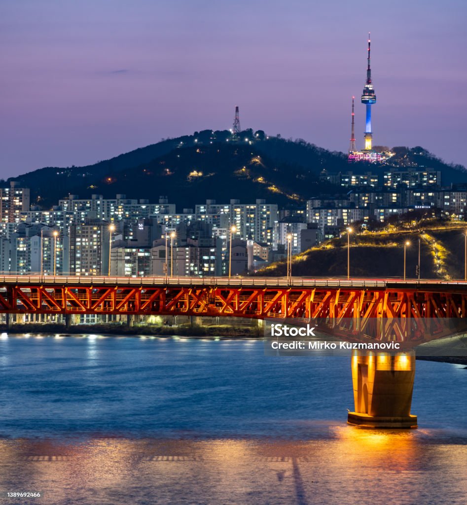 Han river and Seoul Tower on Namsan Mountain in central Seoul South Korea Han river and Seoul Tower on Namsan Mountain in central Seoul South Korea on 2 April 2022 N Seoul Tower Stock Photo