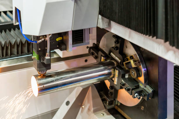 istock close up nozzle & pipe setting clamp with automatic feed and rotate unit during cut by high precision cnc plasma laser cutting machine for engrave or perforate 1389697098