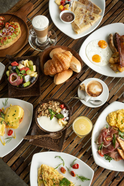 istock Western big gourmet breakfast selection mixed dishes on restaurant table 1389698816