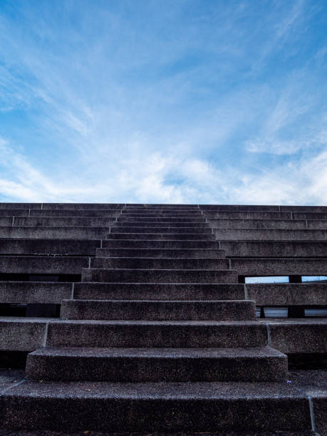 istock stone stair in the way up to blue sky 1389699588