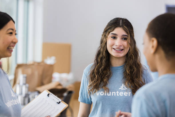 istock Three female volunteers plan food drive 1389699620