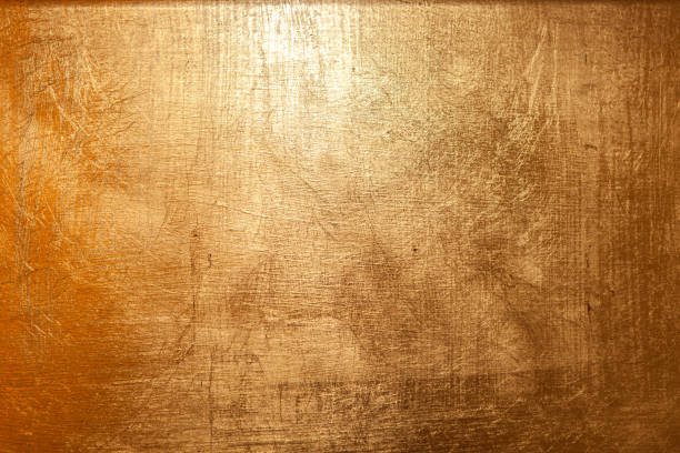 istock A gold painted wall, realistic gold texture. Gold surface. 1389699893