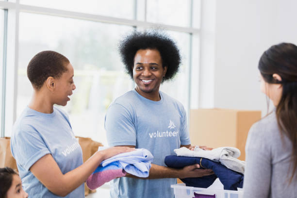 istock Young adults organize clothes 1389700370