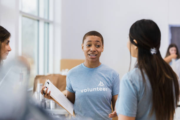 istock Young adult with sign in sheet 1389700845