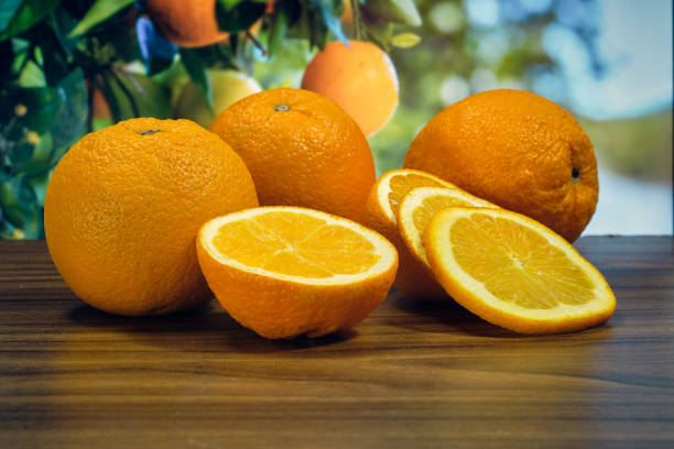 istock Whole oranges and slices on the table 1389701091