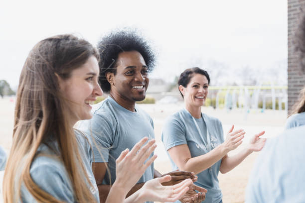 istock Young adults clap and cheer 1389701451