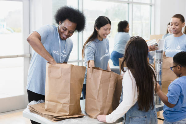istock Young adults enjoying their volunteer time 1389701495