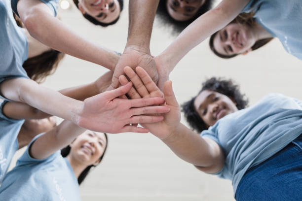 istock Underneath photo of stacked hands 1389701497