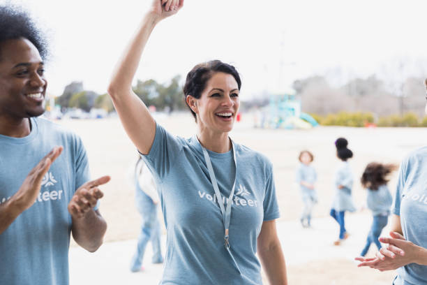 istock Young adult volunteer cheering 1389702256