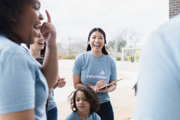 istock Volunteer group laughing and smiling 1389702422