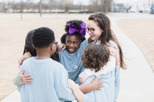 istock Children stand and hug 1389702432