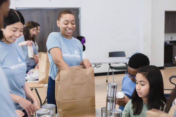 istock Volunteers smiling during the event 1389702461