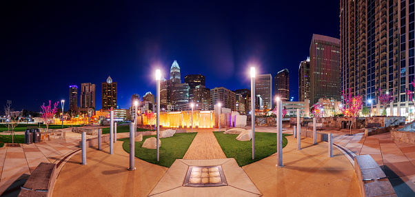 Charlotte, North Carolina, USA uptown skyline and park at night.