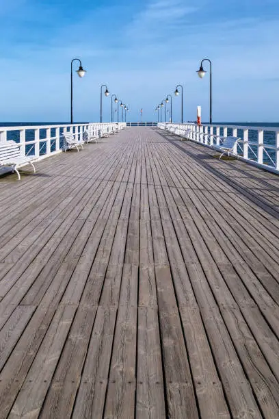 Gdynia, Poland - January 19, 2022:  old wooden pier on the coast of the Baltic Sea Gdynia, Pomeranian Voivodeship of Poland. Popular tourist attraction