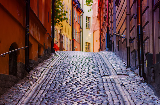 The narrow street of Gamla Stan - historic city old center of Stockholm at summer