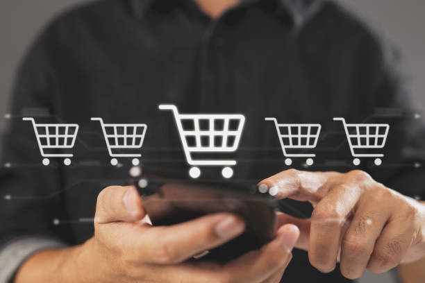 istock Theme of online buying with a smartphone user. 1389705622