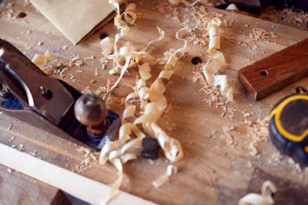 istock Close Up Of Wood Shavings And Carpentry Tools On Workbench 1389706957