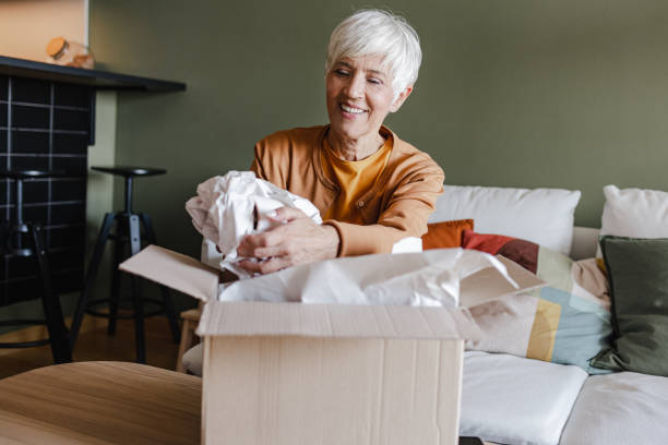 istock Package delivery and unpacking of ordered items at home 1389707253