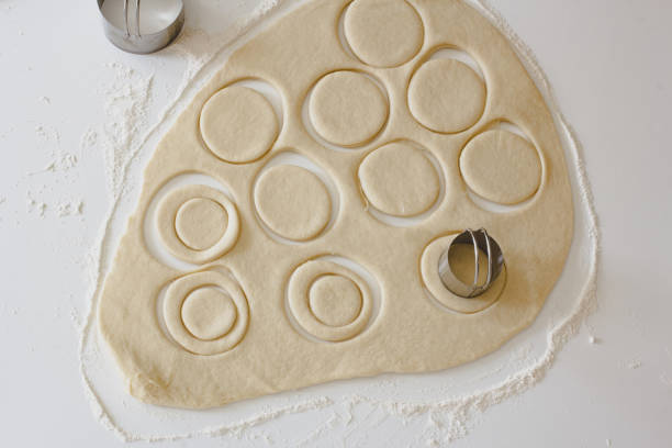 istock flat lay of rolled out and cut dough 1389709338