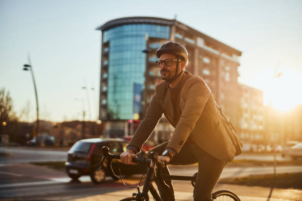istock Businessman commuting to work with his bicycle 1389709611