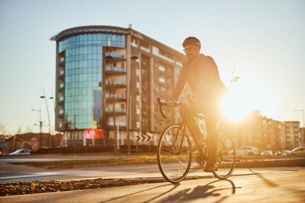 istock Businessman going to work by bike 1389709804