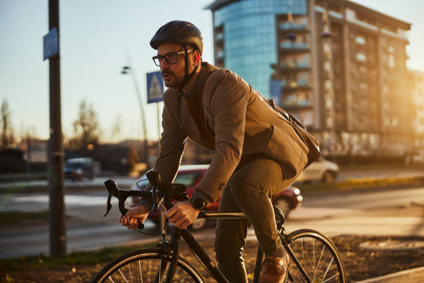 istock Businessman riding bicycle, travels green 1389710004
