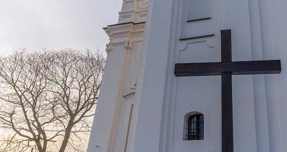 A large wooden Catholic cross on the street. Symbol of Catholicism. Worship concepts. Space for text.