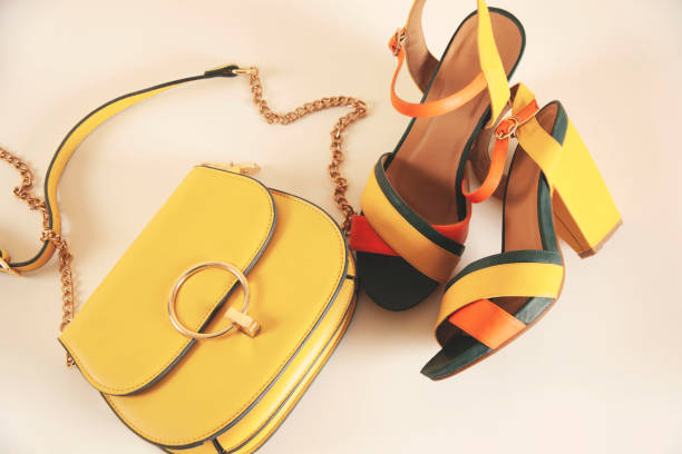 istock woman shoes with bag on white table 1389718139