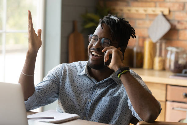 istock Happy joyful millennial African remote employee working from home 1389719458