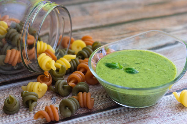 a glass bowl with fresh homemade basil pesto