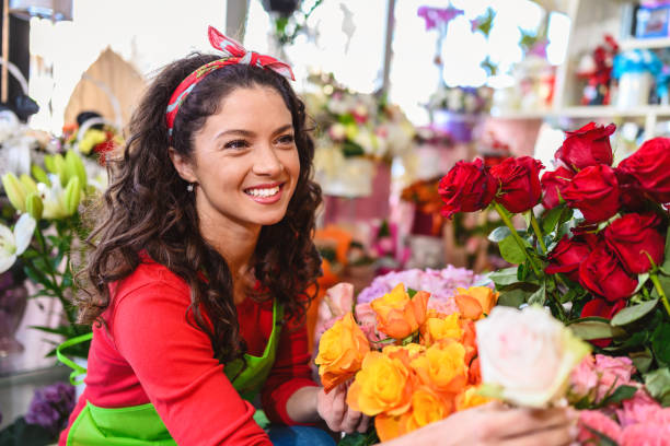 istock Woman working in flower shop 1389721059
