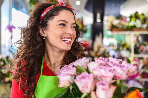 Woman Working with flowers in a flower shop.