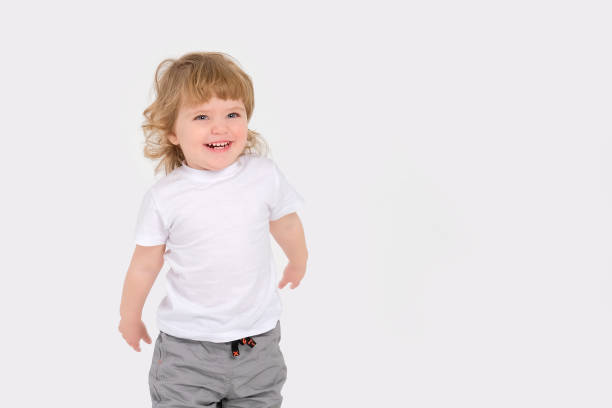 istock Cheerful beautiful baby on a white background. Copy space 1389723099