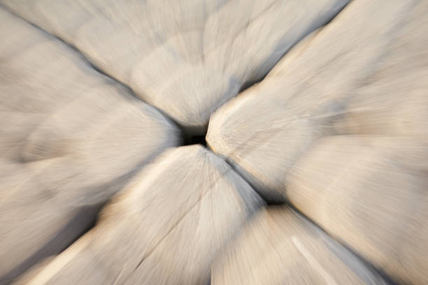 Cobblestone blurred. Light gray stones oblique from above. Zoom in effect. Ideal as background.