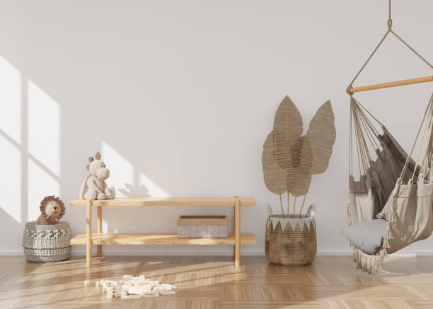 istock Empty white wall in modern child room. Mock up interior in scandinavian, boho style. Copy space for your picture or poster. Console, hanging armchair, rattan basket. Cozy room for kids. 3D rendering. 1389723518