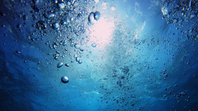 4k video footage of bubbles underwater in the ocean