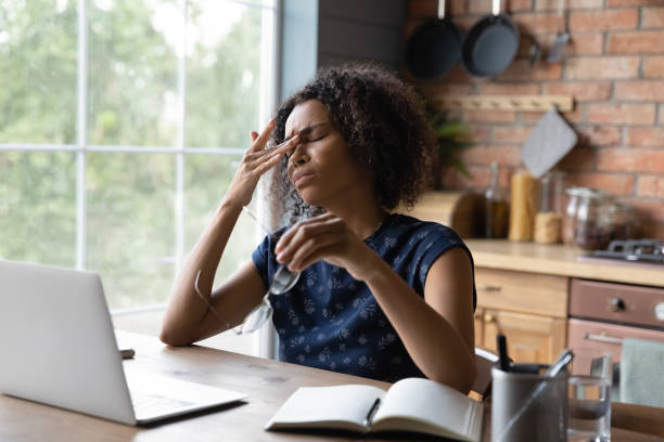 istock Frustrated African American remote employee tired of work at computer 1389727733