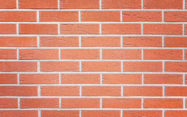 istock background from an orange wall from a new brick 1389729973