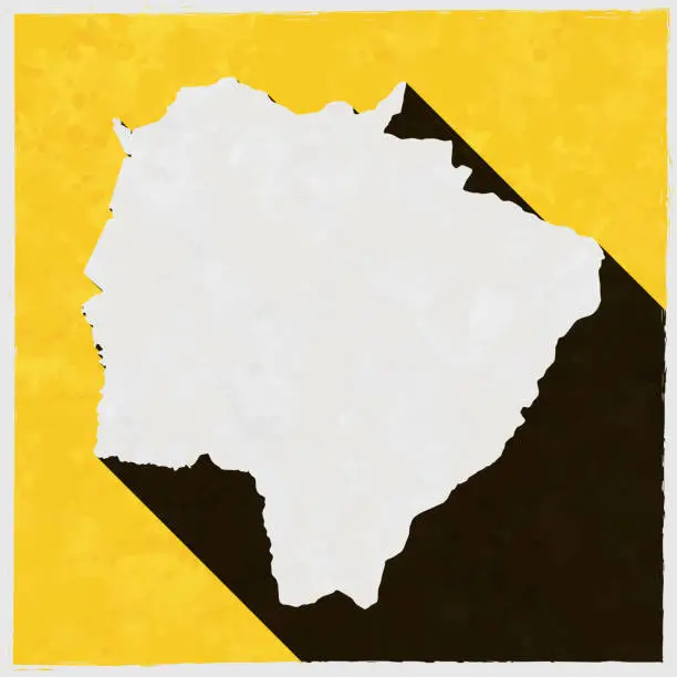 Vector illustration of Mato Grosso do Sul map with long shadow on textured yellow background