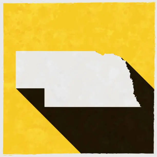 Vector illustration of Nebraska map with long shadow on textured yellow background