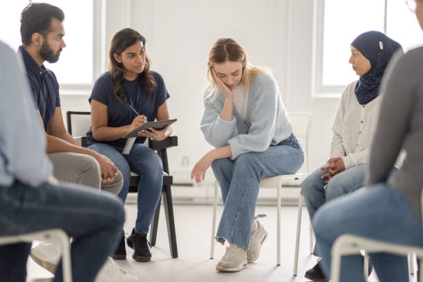 istock Distraught Woman in Group Therapy 1389737225