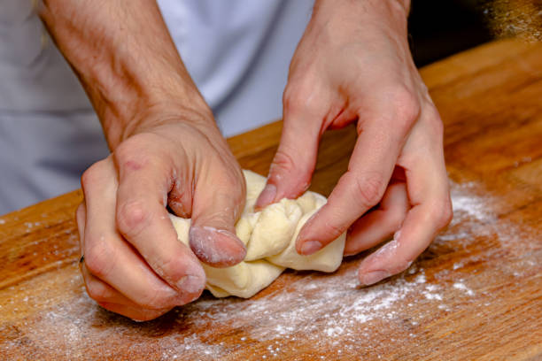 istock The cook prepares dough from flour and eggs 1389738557