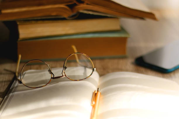 istock Notebook, Pencil, Glasses, Phone and Books 1389740675