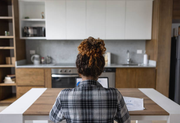 istock Woman working at home on a laptop computer 1389740872